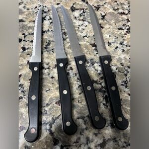 Four Set of Black Handled Steak Knives
